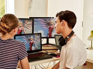 Young couple playing computer games.